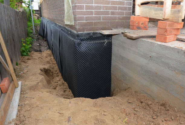 Happy homeowners after waterproofing job in Topeka